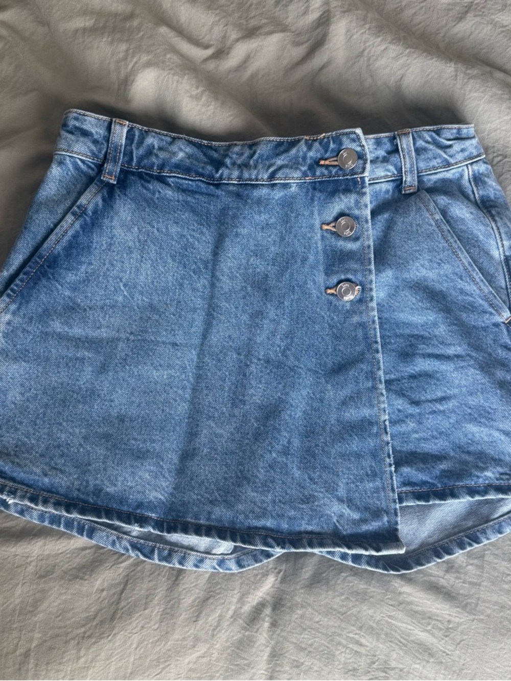 Denim Button-Front Asymmetrical Mini Skirt in Light Blue